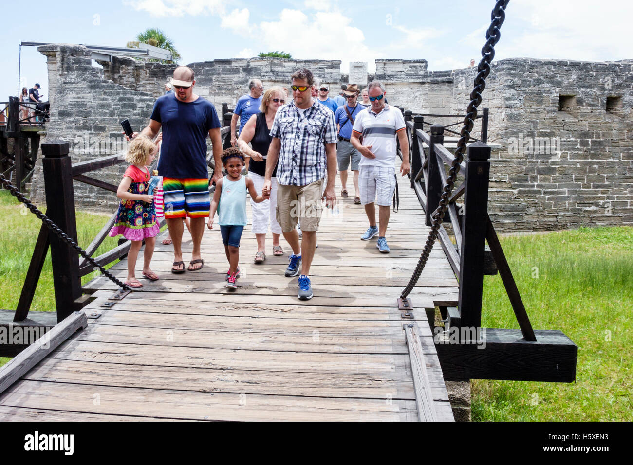 St. Saint Augustine Florida,Castillo de San Marcos National Monument,bridge across moat,families,historic fort,visitors travel traveling tour tourist Stock Photo