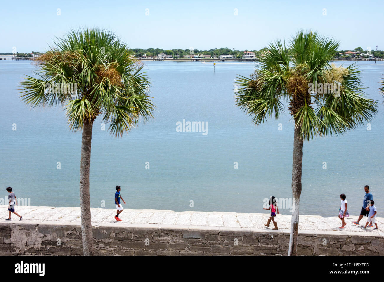 St. Saint Augustine Florida,Castillo de San Marcos National Monument,historic fort,Matanzas Bay water,palm trees,visitors travel traveling tour touris Stock Photo