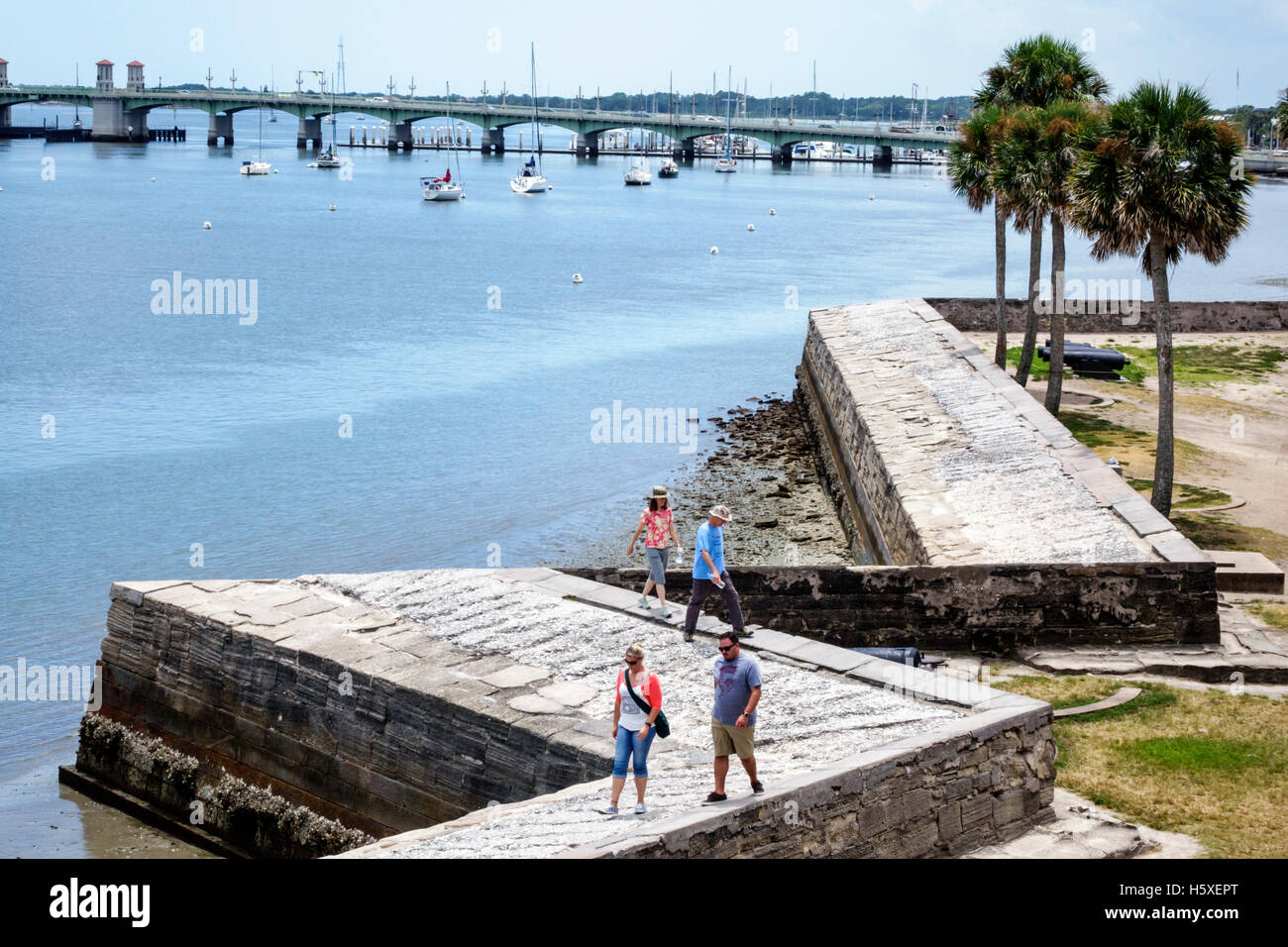 St. Saint Augustine Florida,Castillo de San Marcos National Monument,historic fort,Matanzas Bay water,palm trees,visitors travel traveling tour touris Stock Photo