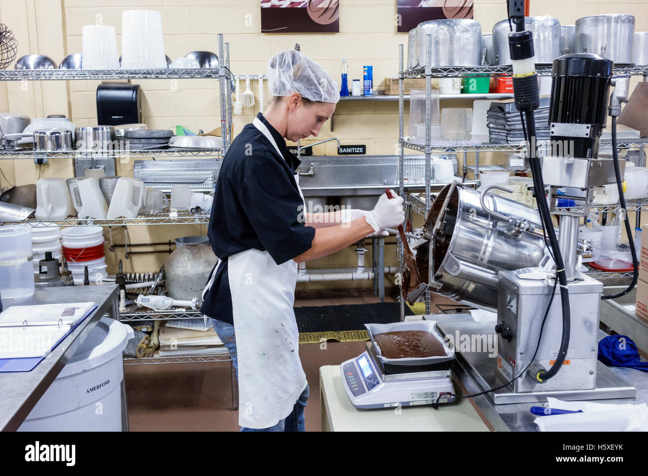 St. Saint Augustine Florida,Whetstone Chocolates,interior inside,factory,production line,fudge,adult adults,woman female women,worker,working work wor Stock Photo