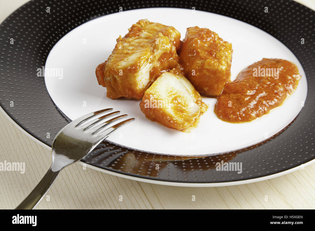 Cod Fish with Tomato, detail of fish cooked with sauce Stock Photo Alamy
