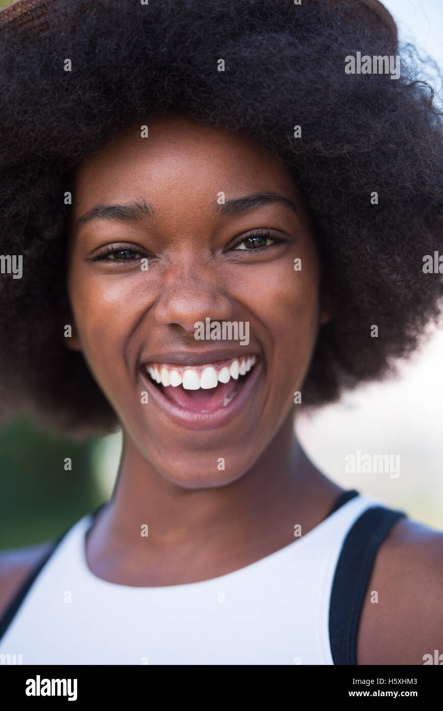 Close up portrait of a beautiful young african american woman smiling ...