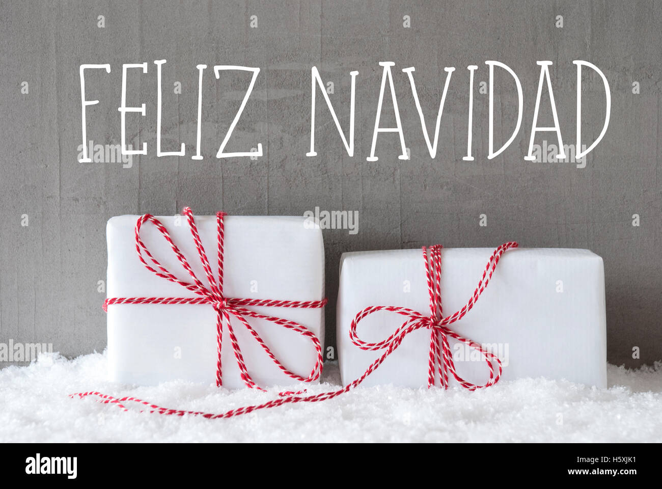 Two Gifts With Snow, Feliz Navidad Means Merry Christmas Stock Photo