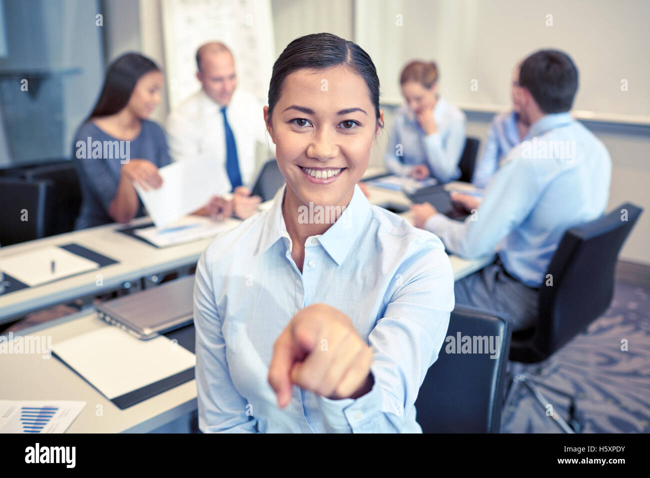 group of smiling businesspeople meeting in office Stock Photo - Alamy