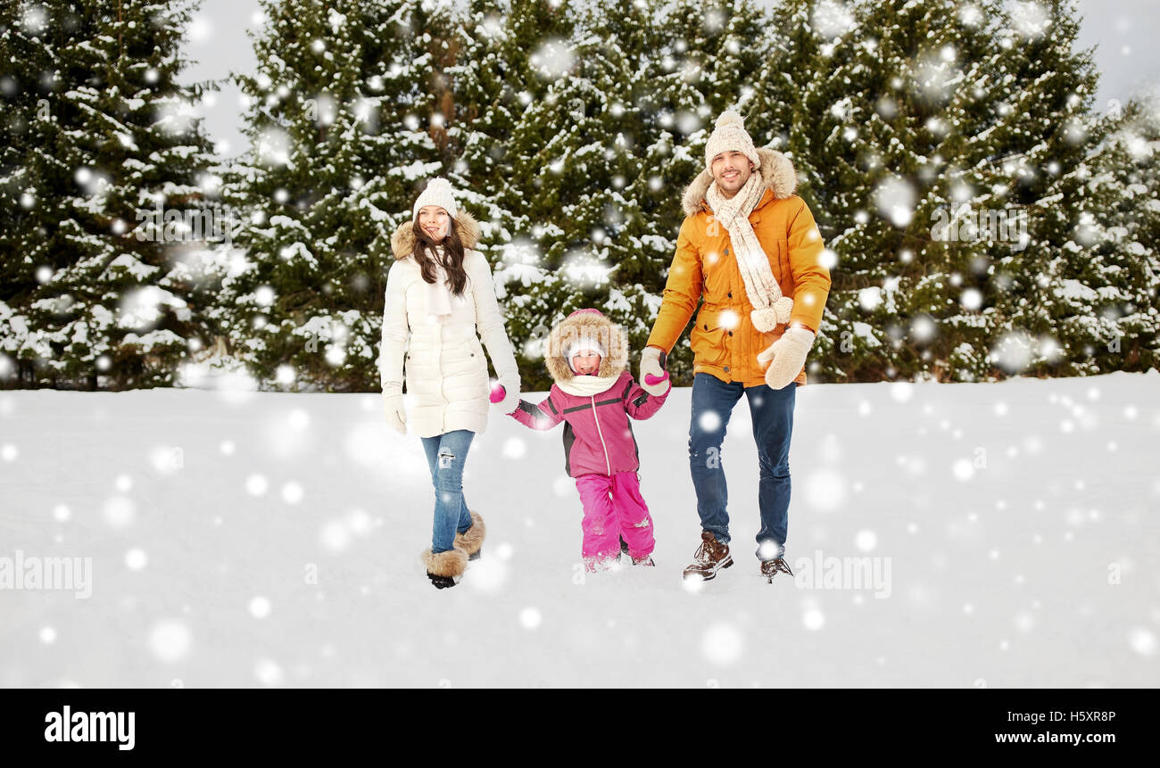 happy family in winter clothes walking outdoors Stock Photo - Alamy