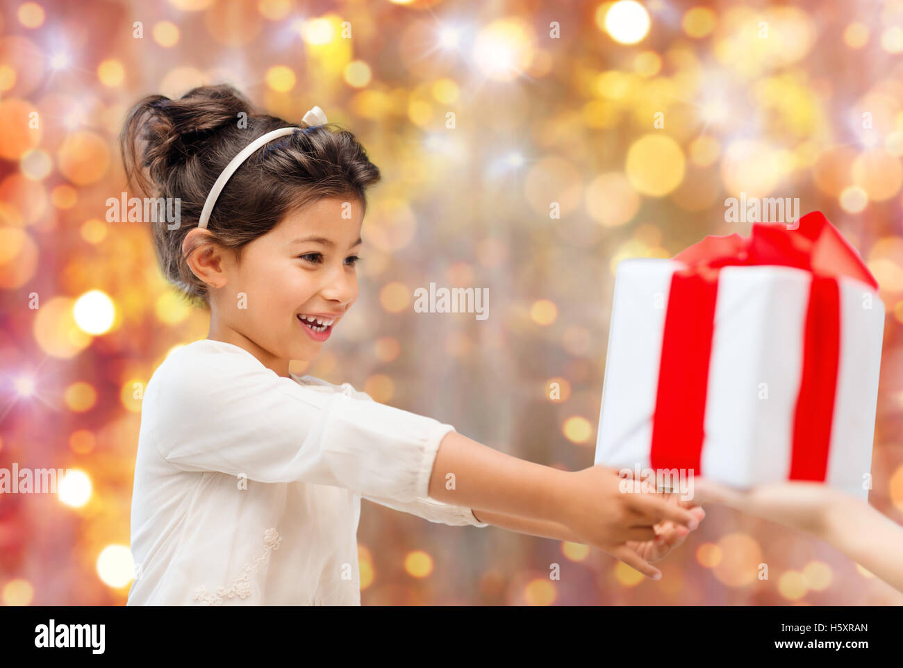 smiling little girl with gift box Stock Photo - Alamy