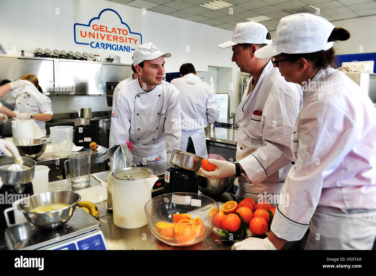 Students at work during a practical lesson at the Carpigiani Gelato University in Anzola nell'Emilia, Italy Stock Photo
