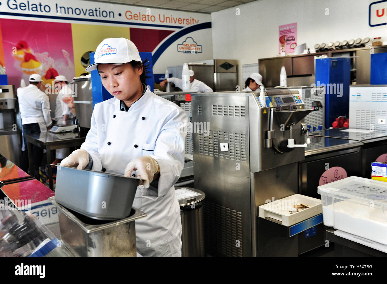 Students at work during a practical lesson at the Carpigiani gelato University in Anzola nell'Emilia, Italy Stock Photo