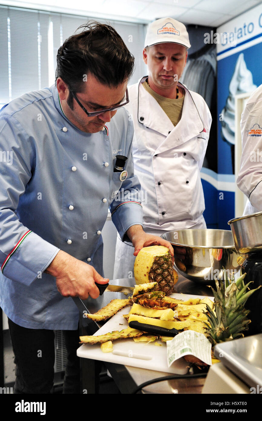 Maestro Palmiro Bruschi with his students during a practical lesson at the Carpigiani Gelato University in Anzola nell'Emilia Stock Photo