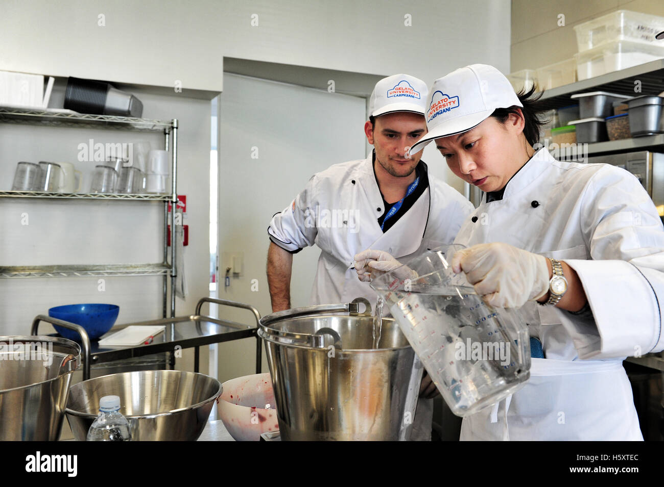Students at work during a practical lesson at the Carpigiani Gelato University in Anzola nell'Emilia near Bologna, Italy. Stock Photo