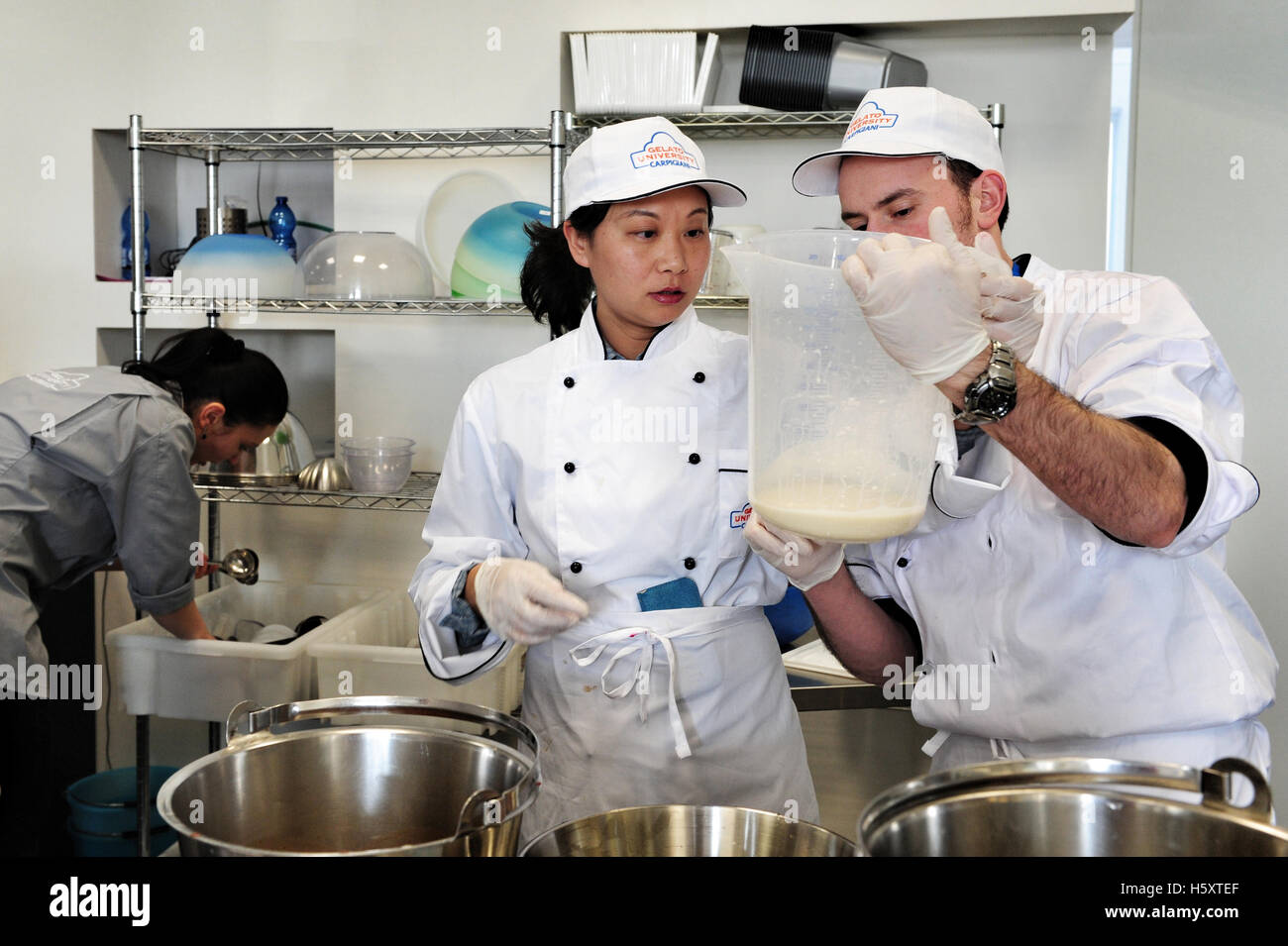 Students at work during a practical lesson at the Carpigiani Gelato University in Anzola nell'Emilia near Bologna, Italy. Stock Photo