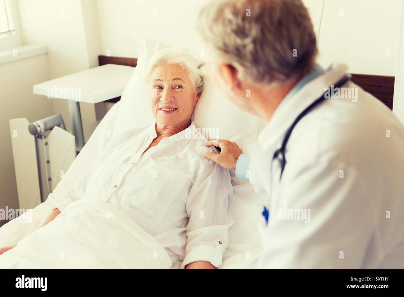 Old man visiting doctor hi-res stock photography and images - Alamy