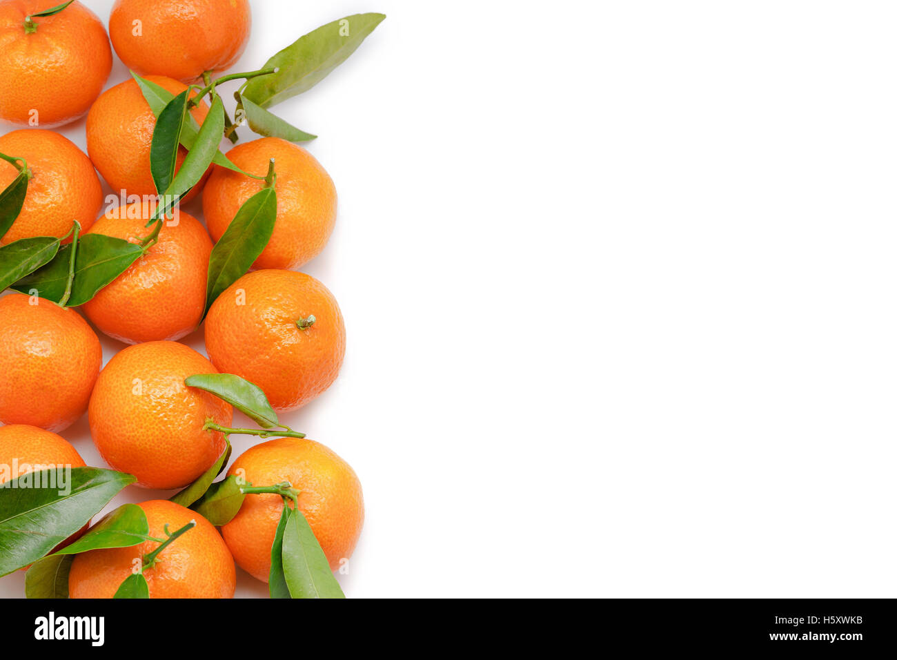 Tangerines with leaves isolated on white background with copy space Stock Photo