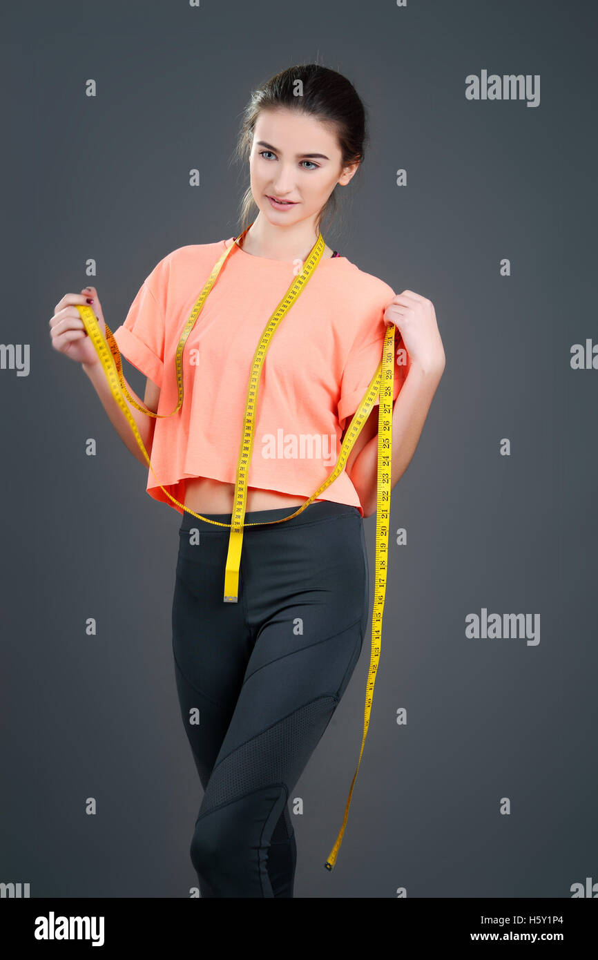 Woman measuring her body - weight loss concepts Stock Photo - Alamy