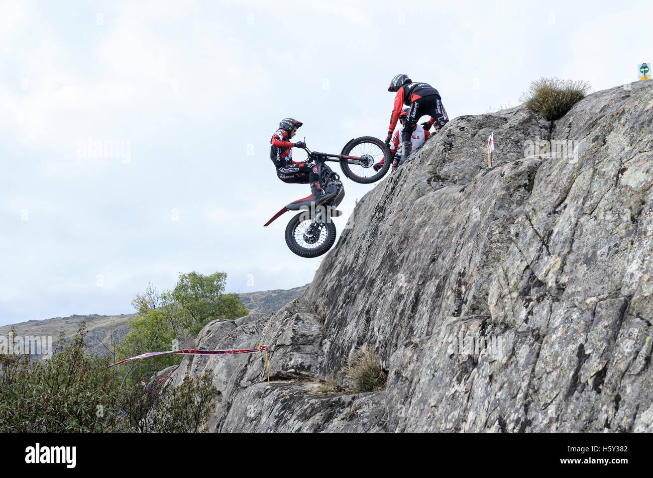 Motorcycling. Trial race. Spain championship. Oriol Noguera overtaking an obstacle, over granite rocks, in Valdemanco Stock Photo