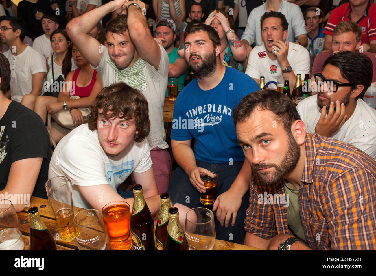 England rugby fans watch a world cup warm up game against France in the Faltering Fullback pub in Finsbury Park, north London Stock Photo