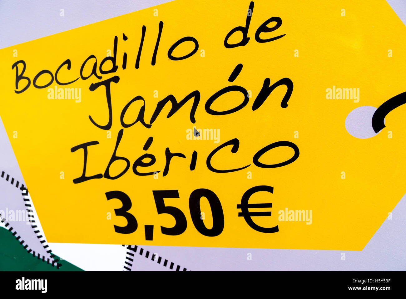 A handwritten sign advertising Iberian ham sandwiches for sale Stock Photo