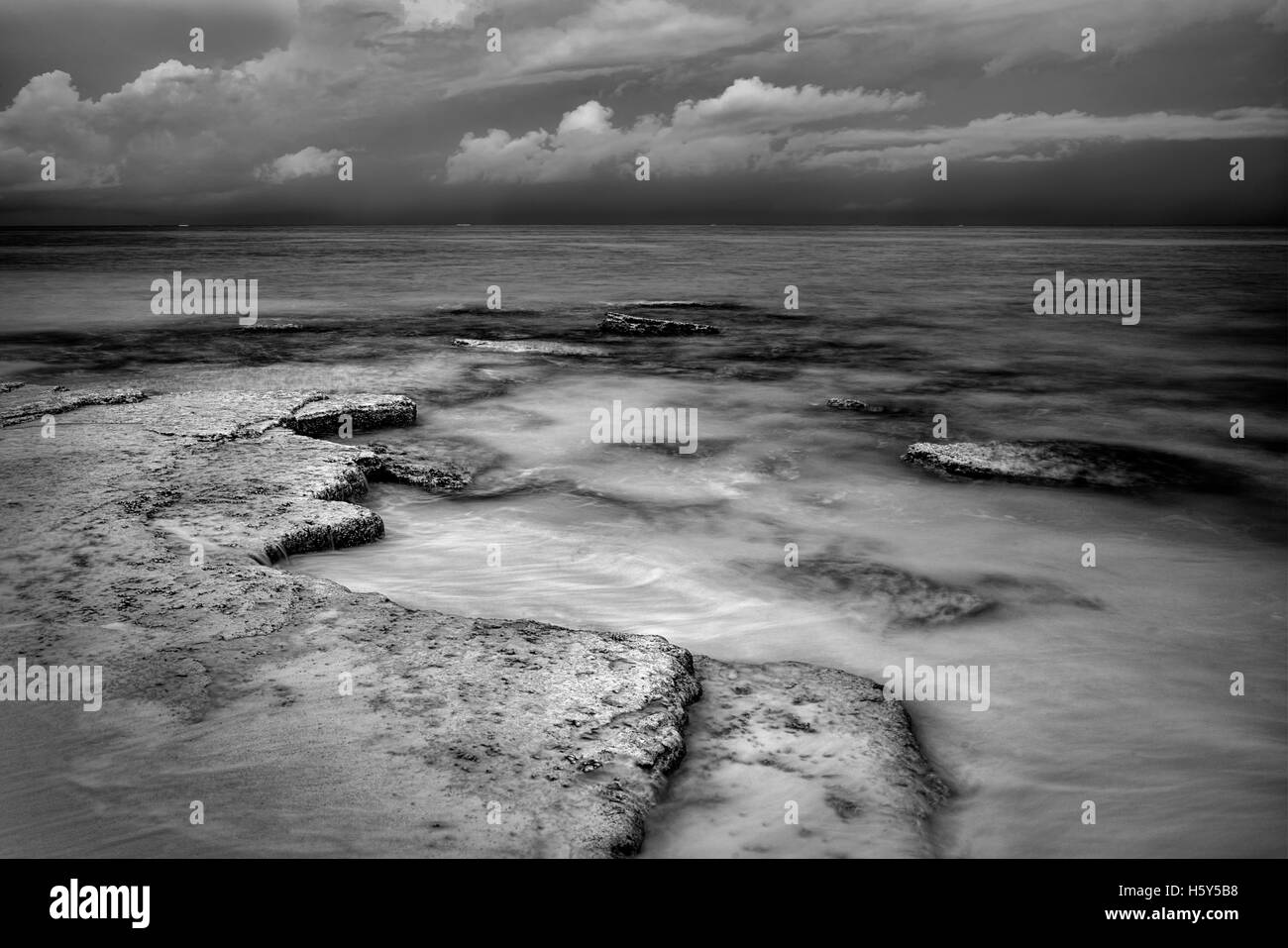 Shore and storm clouds over ocean at Turks and Caicos. Stock Photo