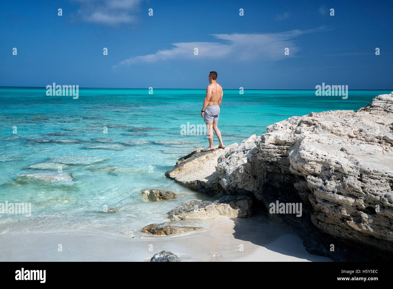 Visitor viewing ocean at Half Moon Bay. Turks and Caicos. Providenciales. Stock Photo