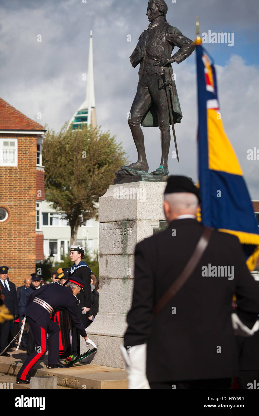 Lord-Lieutenant of Hampshire, NIGEL ATKINSON lays a wreath at the statue of Lord Nelson in Old Portsmouth. Lord-Lieutenant of Hampshire, NIGEL ATKINSON and Lord Mayor of Portsmouth, Councillor DAVID FULLER, have taken part in the annual Seafarer's Service held at Portsmouth Cathedral, and the laying of wreaths at the statue of Lord Nelson. The service is held annually, on the first Sunday prior to the anniversary of the Battle of Trafalgar, 21st October, and remembers those who have lost their lives at sea, and also commemorates the life of Lord Horatio Nelson. Stock Photo