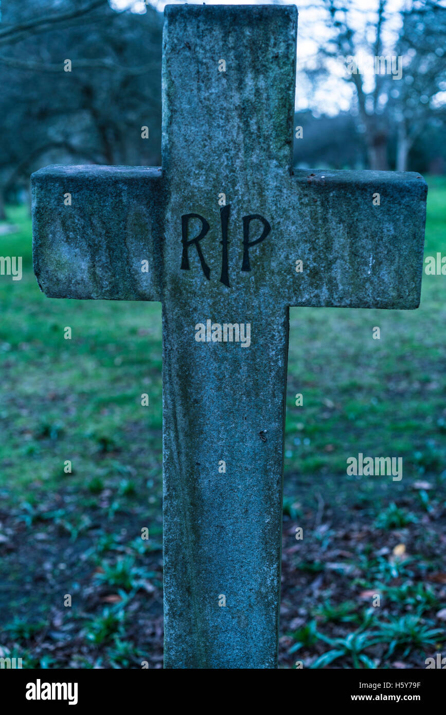 Old grave RIP Rest in peace crucifix on a cemetery Stock Photo - Alamy