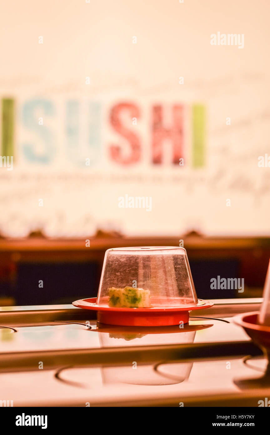 dish on the conveyor belt sushi in a Kaiten Sushi Japanese Restaurant Stock Photo