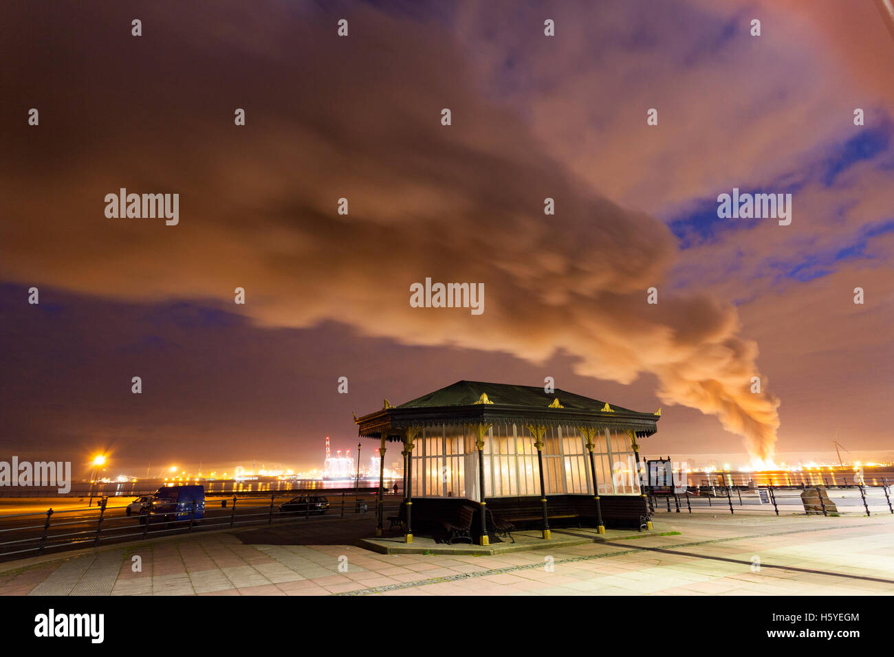 Large fire at Liverpool Docks in the early hours viewed from across the Mersey River at New Brighton Stock Photo