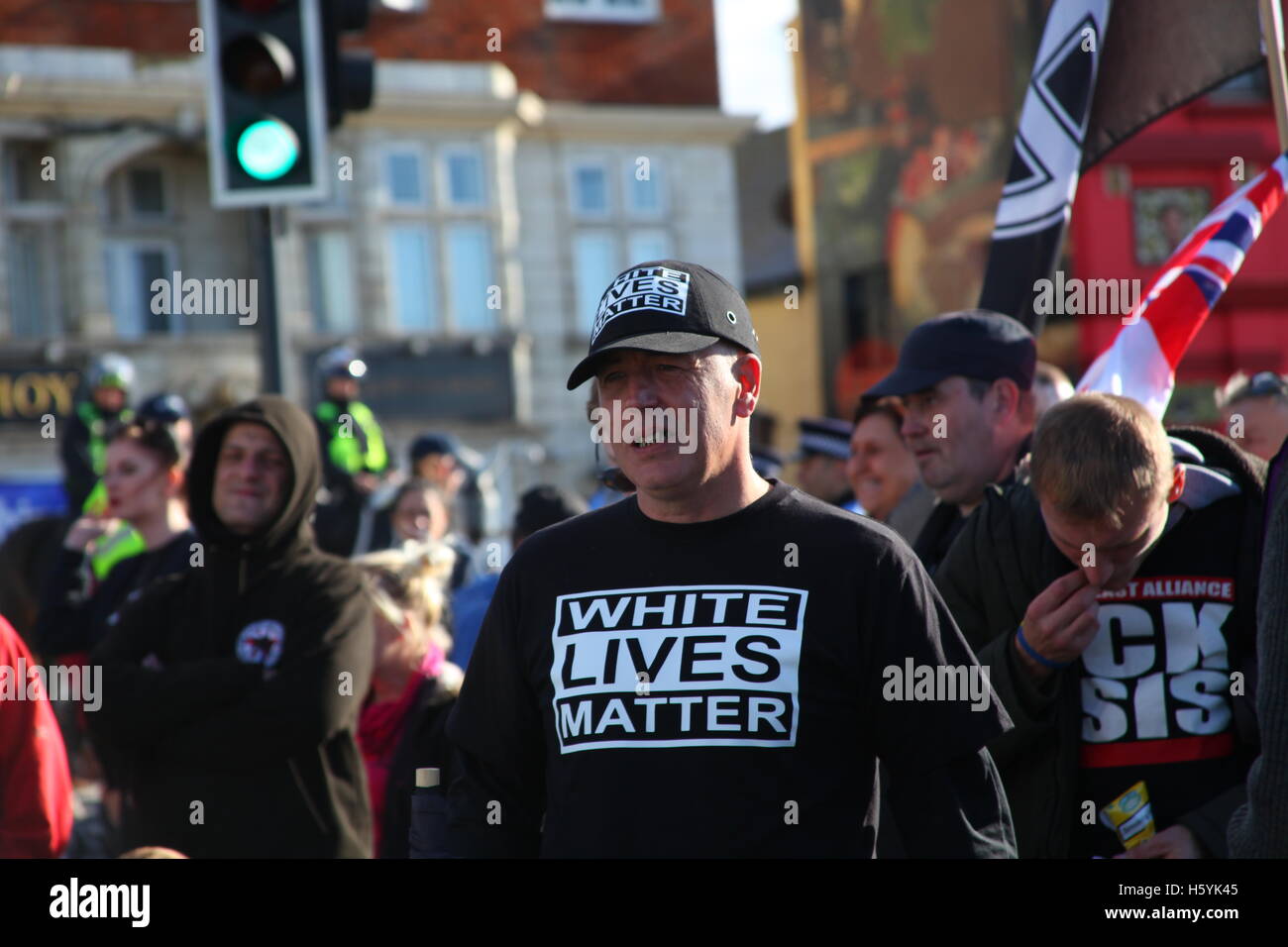 Margate, Kent, UK. 22nd October, 2016. Demonstrator with white lives matter message. The right wing group White Lives Matter (WLM) march in the town. This is the first WLM demonstration in the UK. A counter demonstration, Margate Rocks Against Racism (MRAR) is taking place in the town at the same time. Penelope Barritt/Alamy Live News Stock Photo