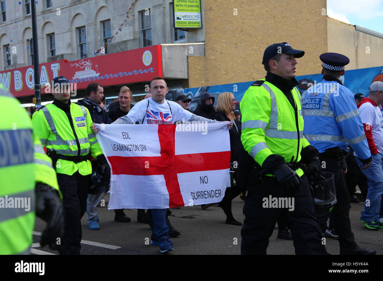 Margate, Kent, UK. 22nd October, 2016. A man with an EDL flag. The right wing group White Lives Matter (WLM) march in the town. This is the first WLM demonstration in the UK. A counter demonstration, Margate Rocks Against Racism (MRAR) is taking place in the town at the same time. Penelope Barritt/Alamy Live News Stock Photo