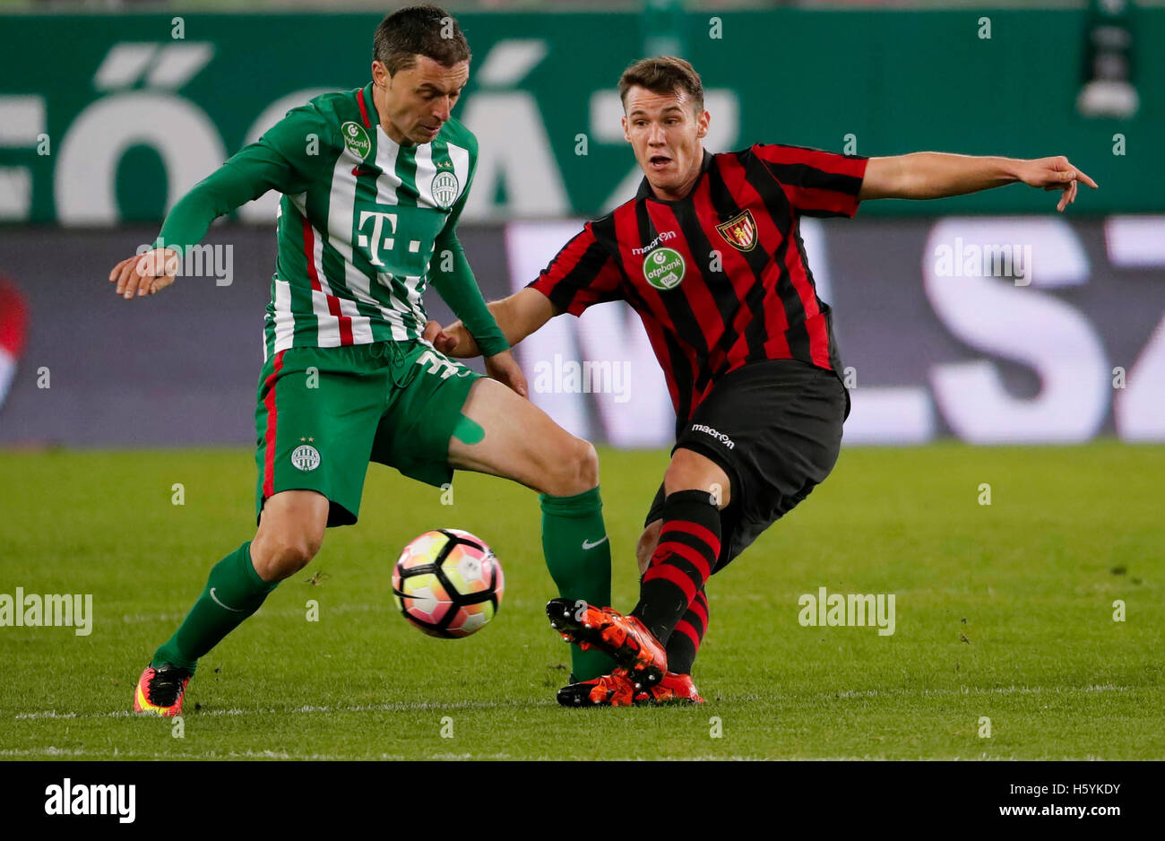 BUDAPEST, HUNGARY - JUNE 27: (l-r) Tokmac Chol Nguen of Ferencvarosi TC  fights for the ball with Dániel Farkas of Mezokovesd Zsory FC during the  Hungarian OTP Bank Liga match between Ferencvarosi TC and Mezokovesd Zsory  FC at Groupama