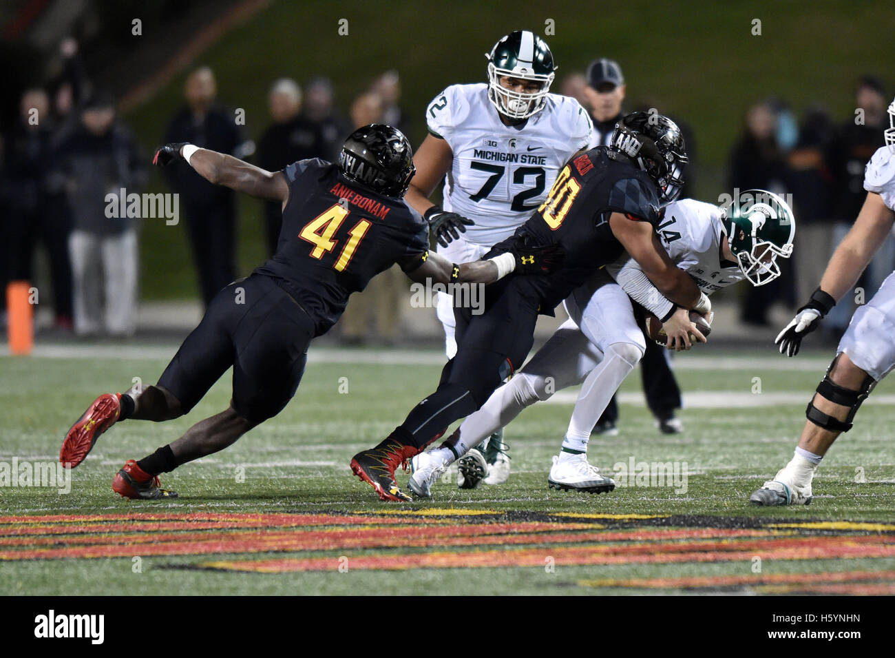 College Park, Maryland, USA. 22nd Oct, 2016. Maryland Terrapins defensive lineman ROMAN BRAGLIO (90) sacks Michigan State Spartans quarterback BRIAN LEWERKE (14) during a game played at Maryland Stadium at College Park, MD. The Terrapins beat the Spartans 28-17. © Ken Inness/ZUMA Wire/Alamy Live News Stock Photo