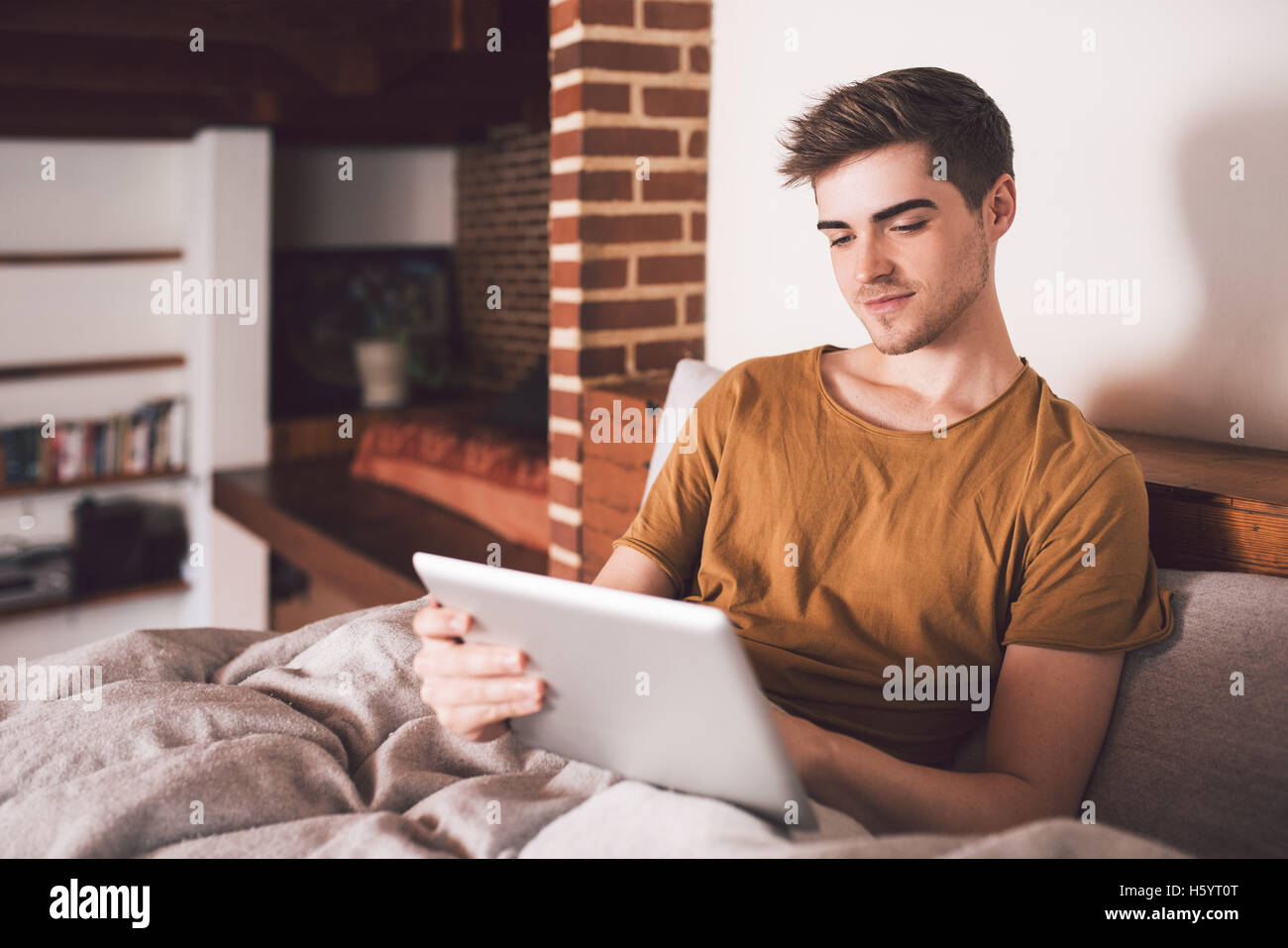 Morning is his time to catch up onine Stock Photo