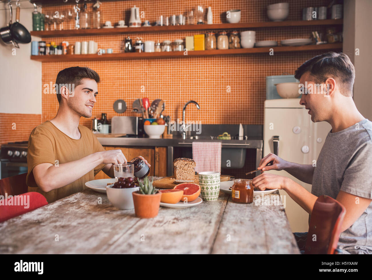 Sharing time together over breakfast Stock Photo - Alamy
