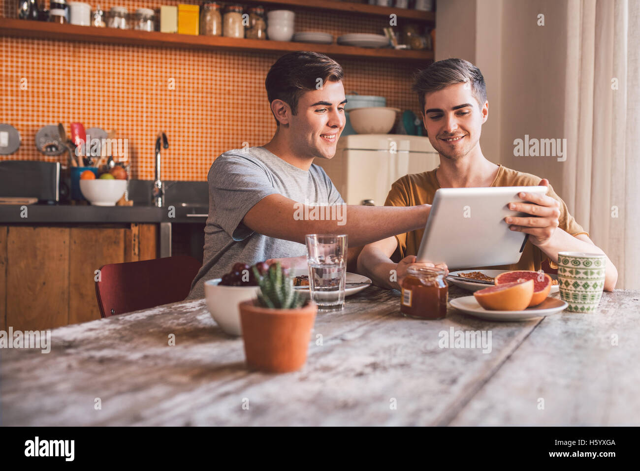 Browsing together over breakfast Stock Photo