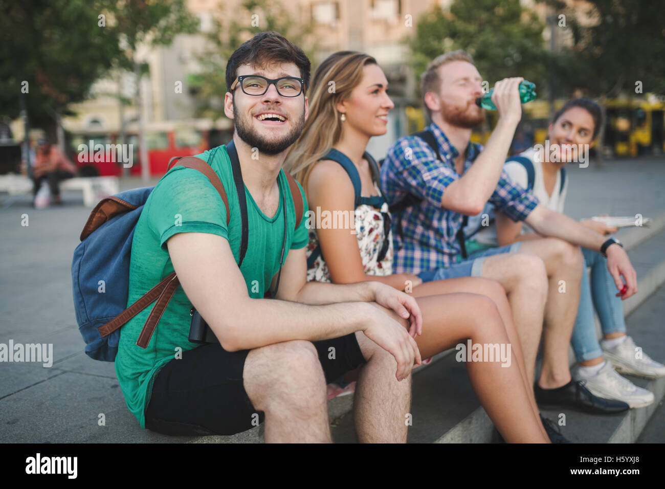 Happy students hanging out outdoors Stock Photo
