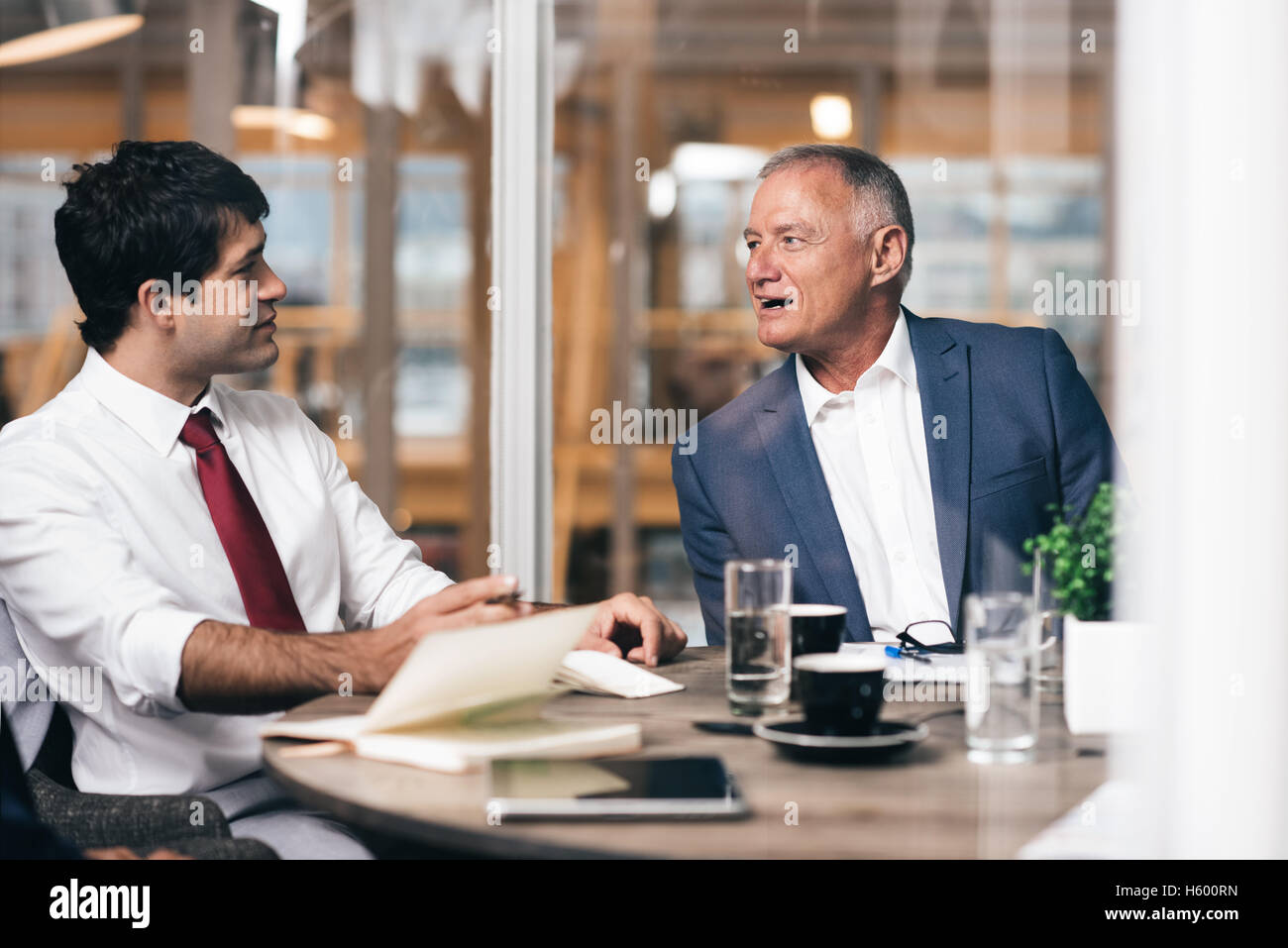 Passing on his business experience Stock Photo