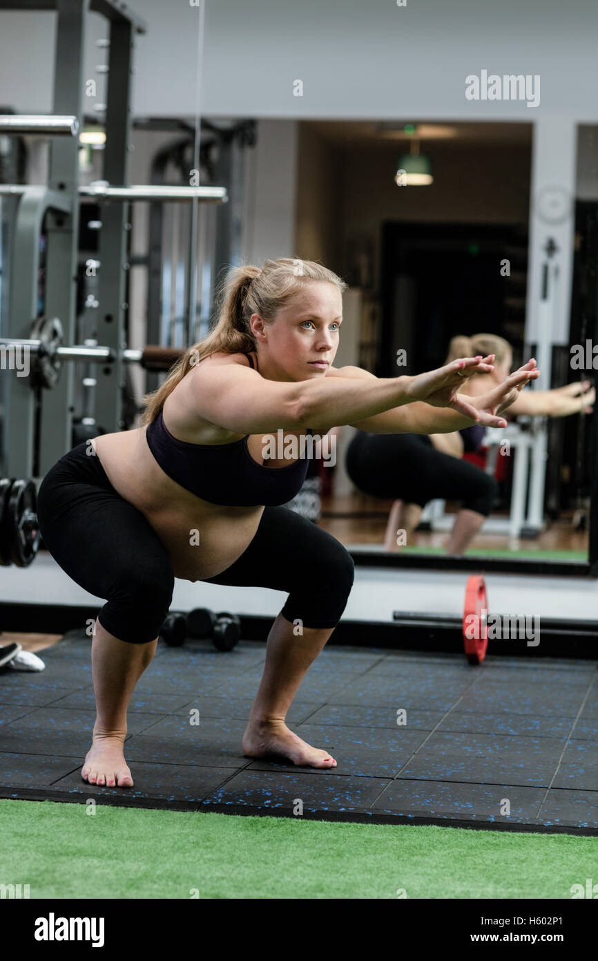 Picture of Pregnant woman performing stretching exercise Stock Photo - Alamy