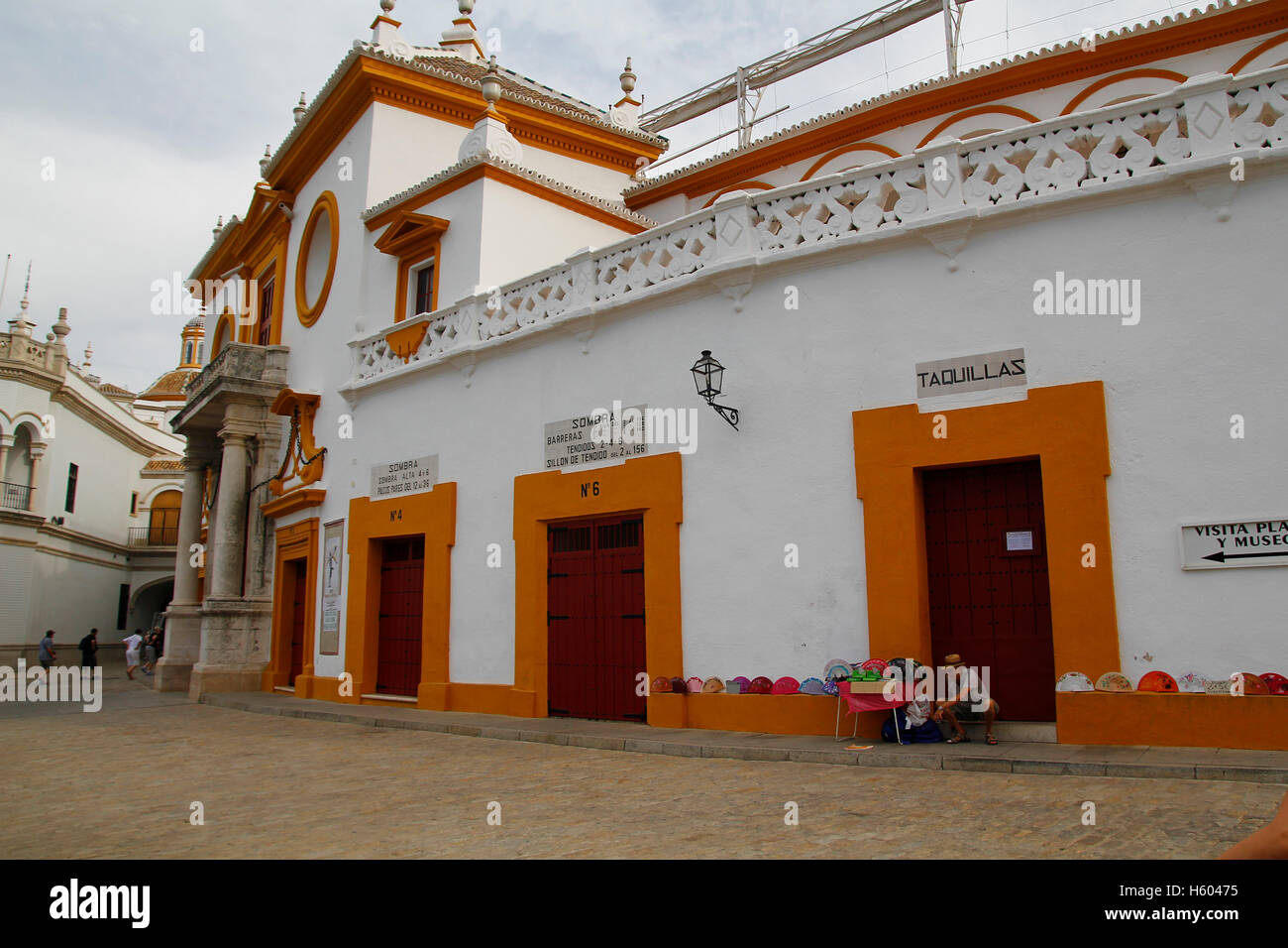 Seville bullring outdoors, with tourists and souvenirs Stock Photo Alamy