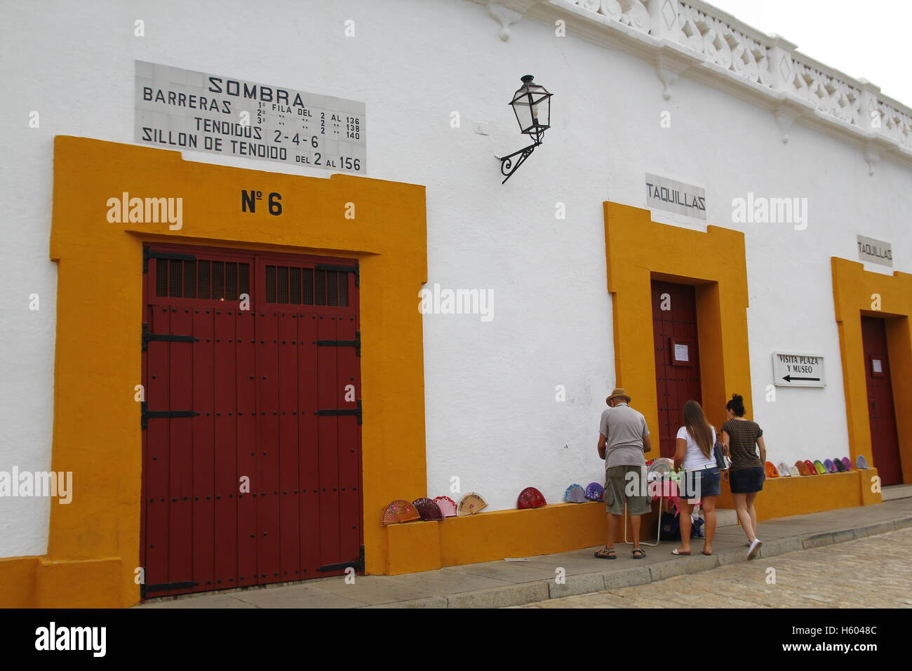 Seville bullring outdoors, with tourists and souvenirs Stock Photo Alamy