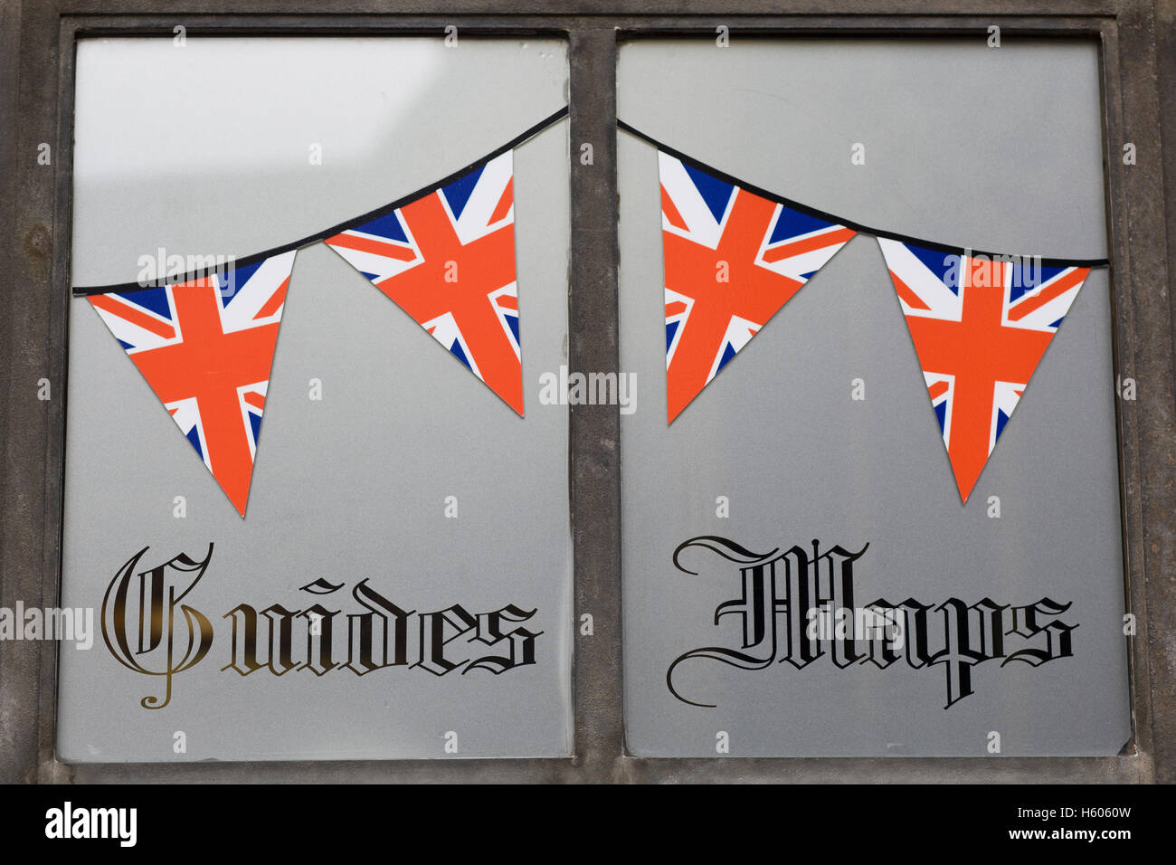 Guides and maps written with union jack bunting on a frosted window Stock Photo