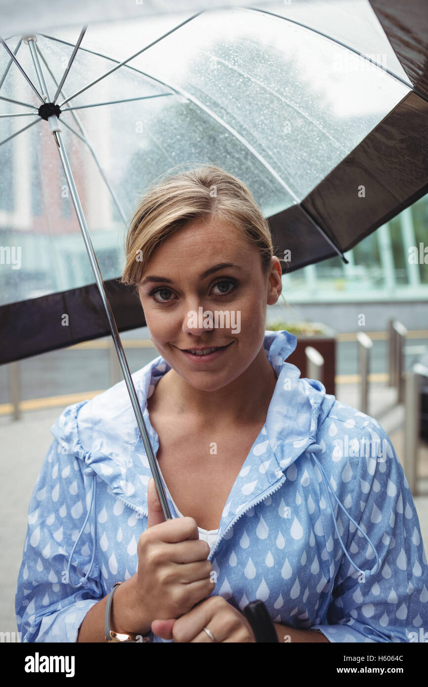 Portrait of beautiful woman holding umbrella Stock Photo