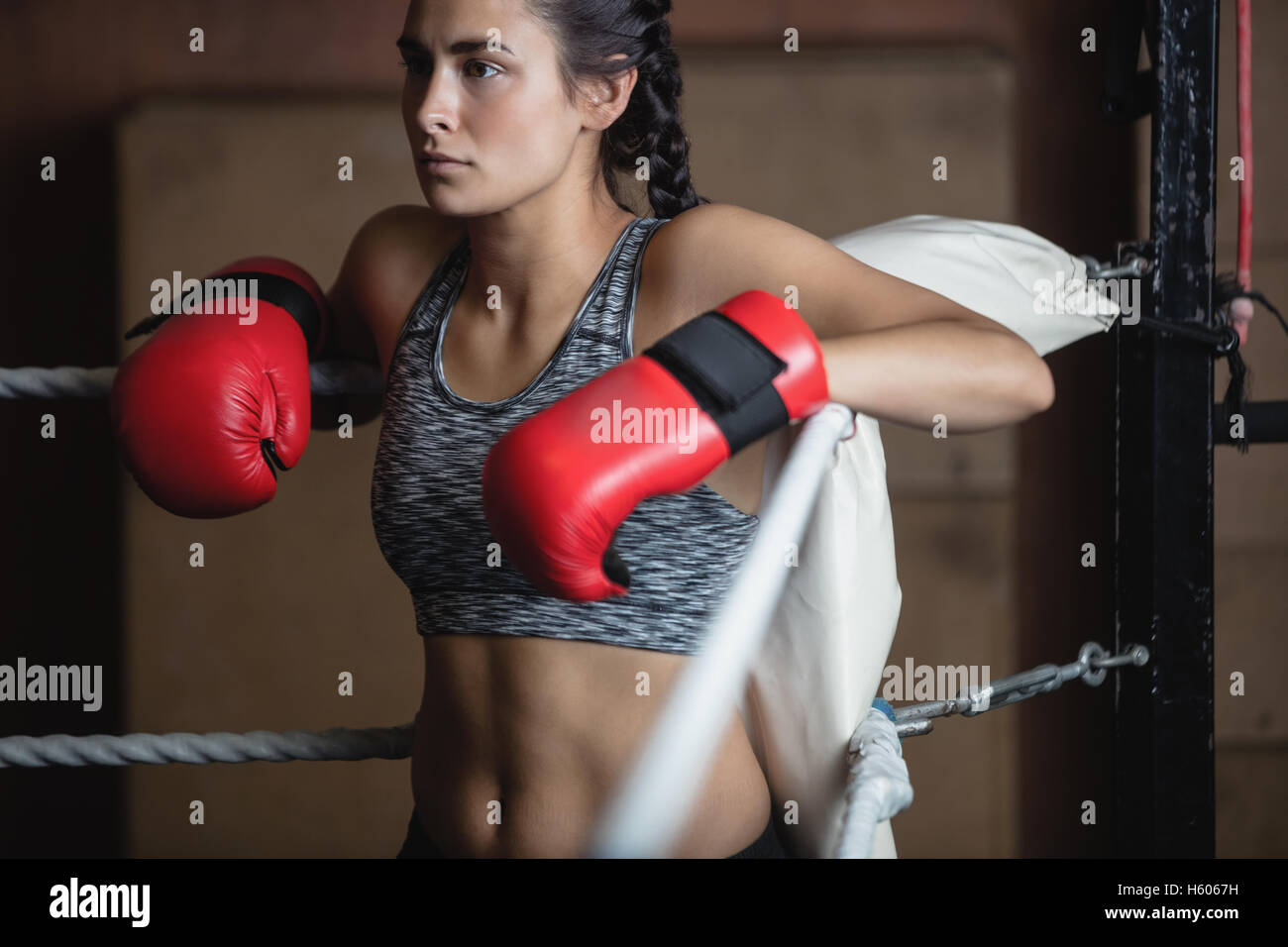 Tired female boxer in boxing gloves Stock Photo Alamy