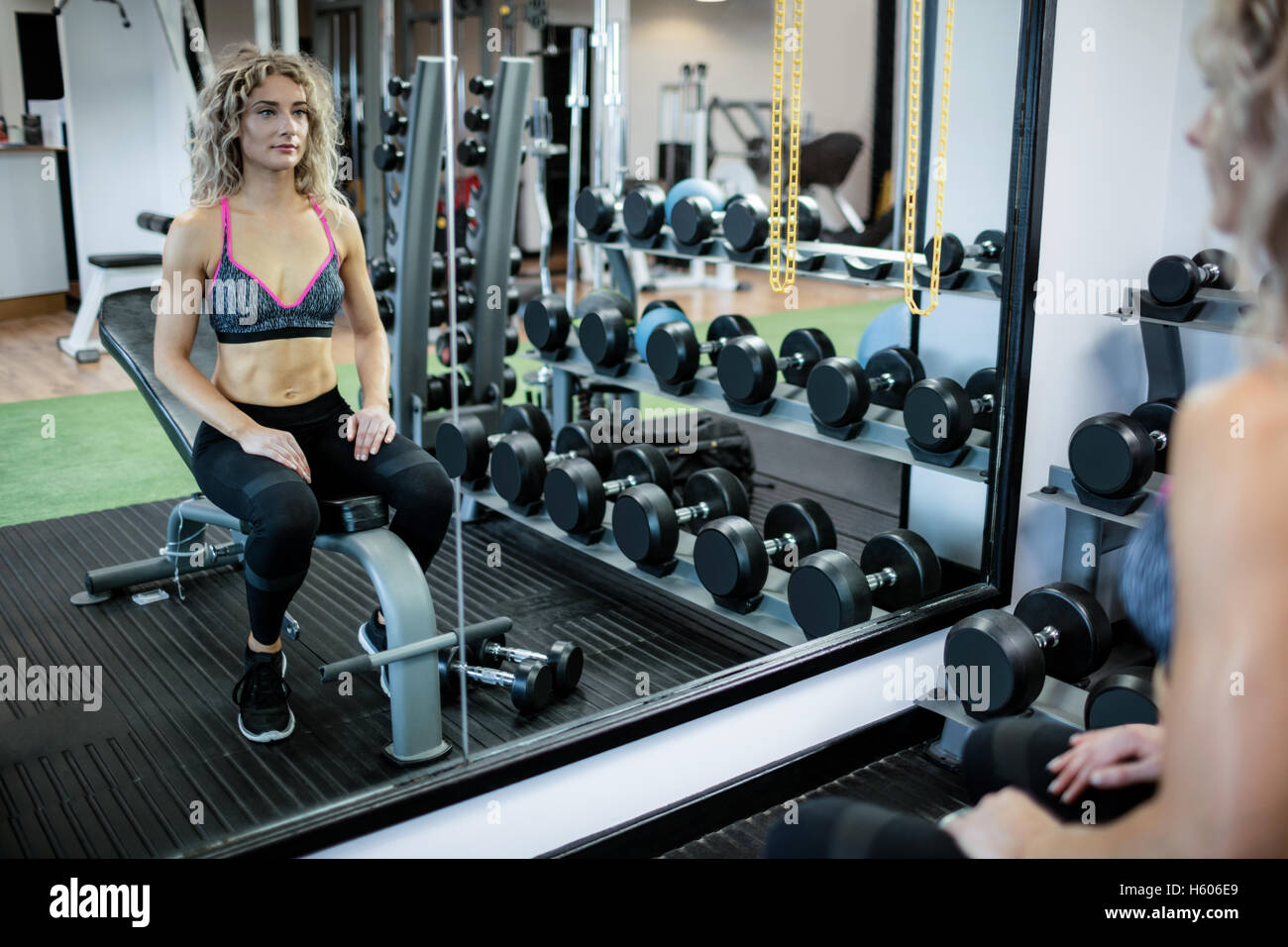 Beautiful woman working out in gym Stock Photo