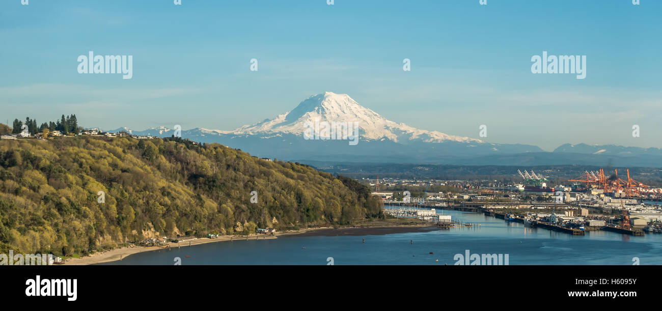 A panoramic view of majestic Mount Rainier towering over the Port of Tacoma. Stock Photo