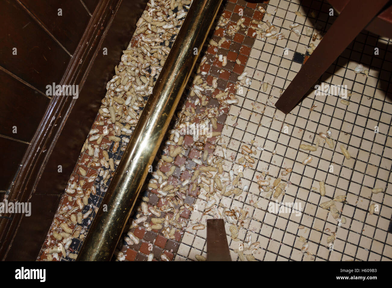 Peanut shells on the floor in The Long Bar, Raffles hotel, Singapore Stock Photo
