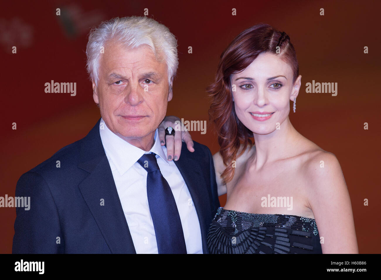 Rome, Italy. 21st Oct, 2016. Italian director Michele Placido and producer  Federica Vincenti walk the red carpet during the film's premiere of “7  minuti” at the 11th annual Rome Film Fest at