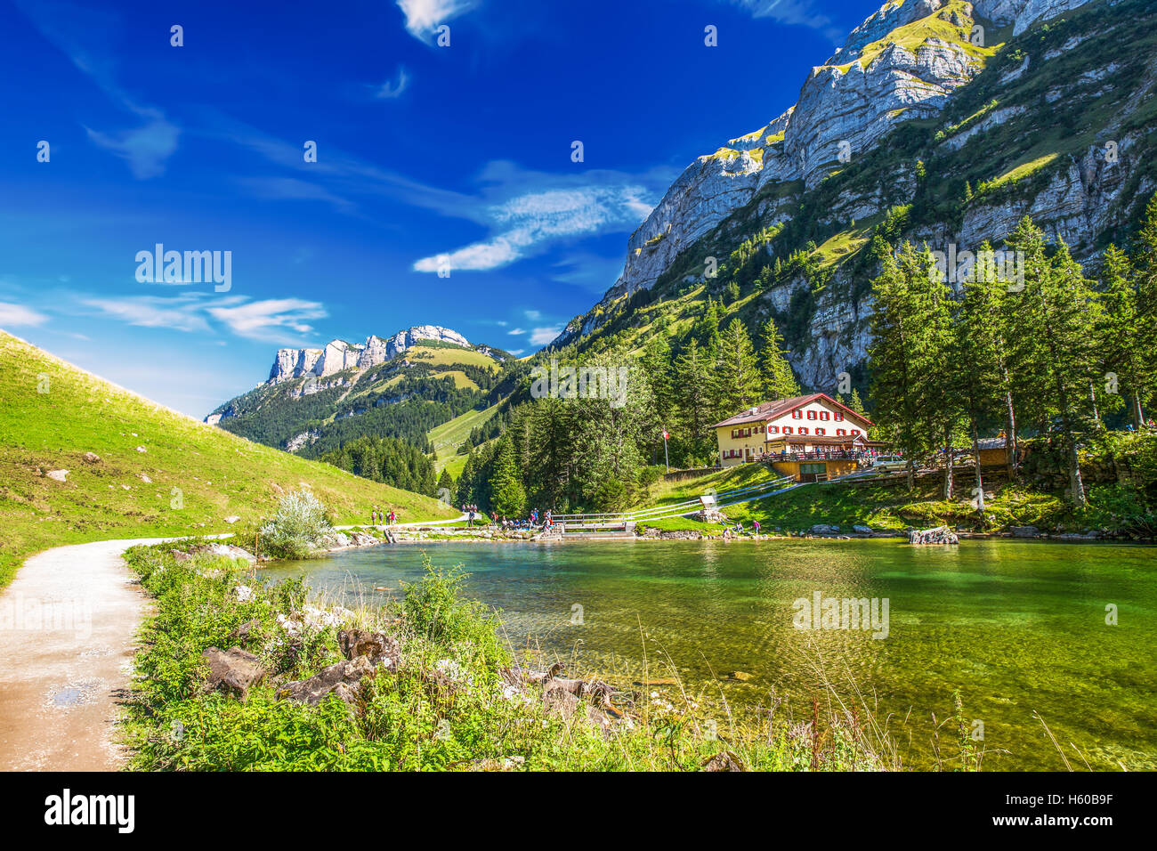 Tourquise clear Seealpsee with the Swiss Alps (mountain Santis) in the background, Appenzeller Land, Switzerland Stock Photo