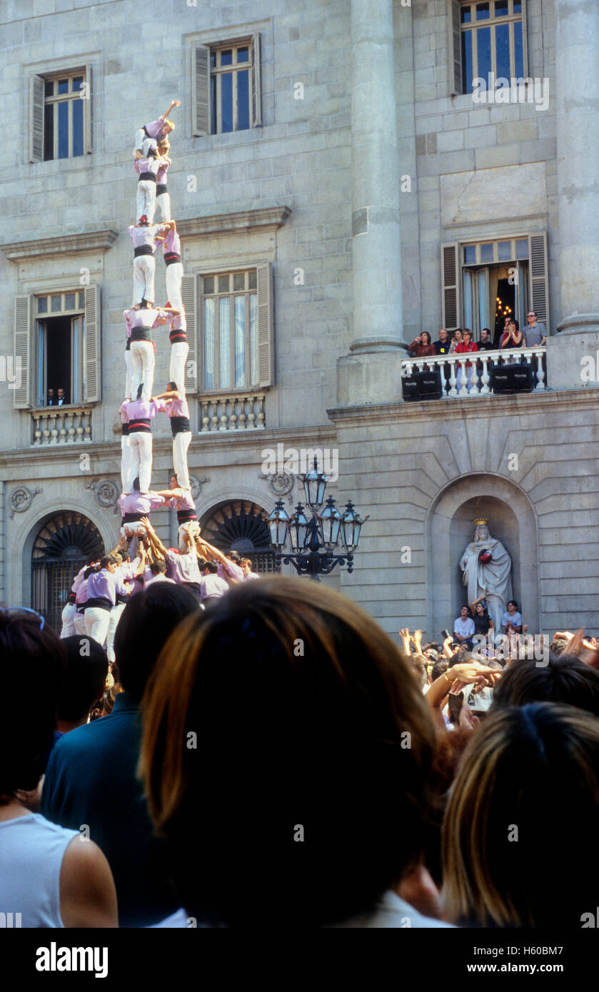 Minyons de Terrassa.'Castellers' building human tower, a Catalan tradition.Festa de la Merçe, city festival. Plaça de Sant Jaume Stock Photo