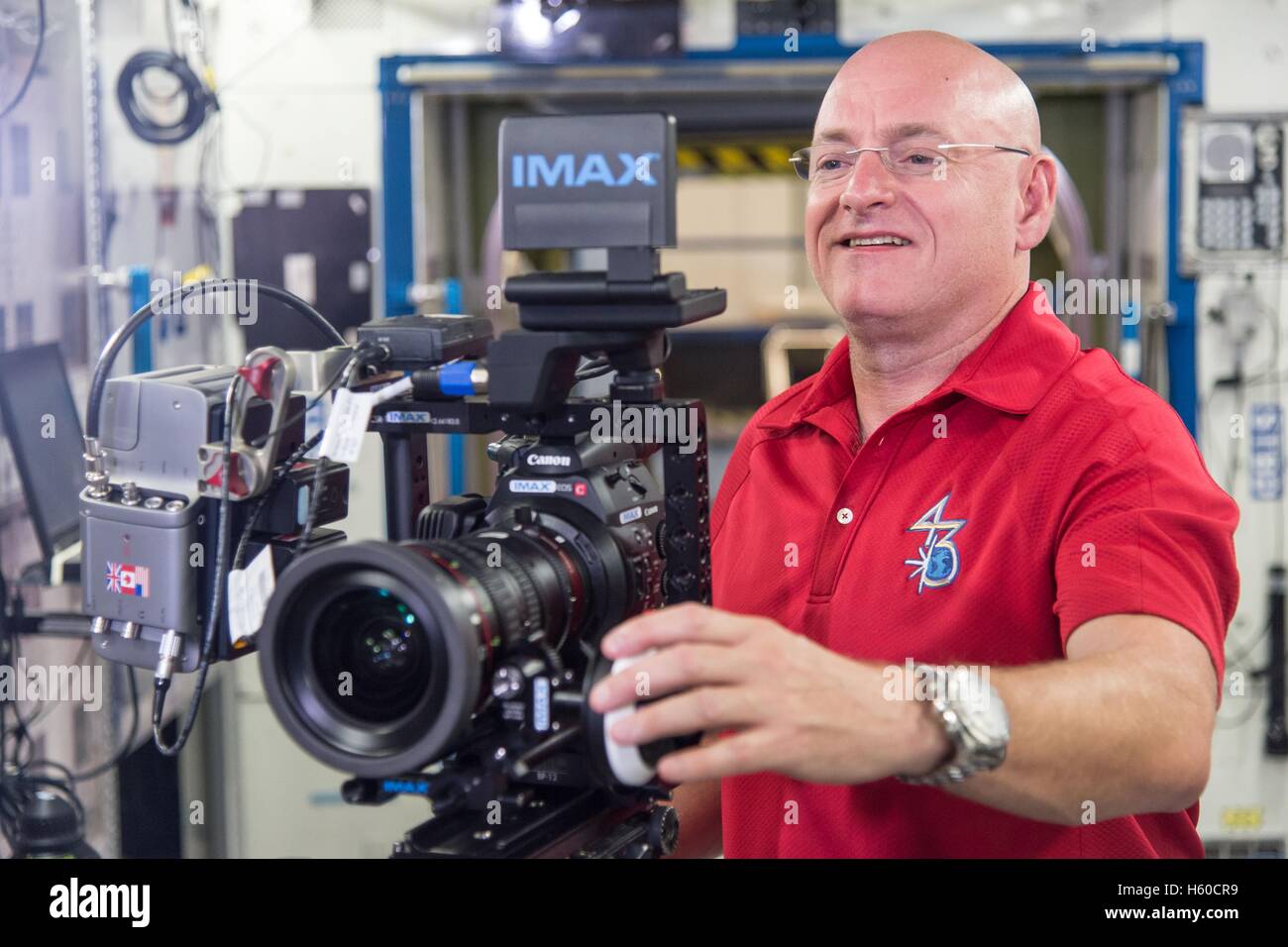NASA astronaut Scott Kelly undergoes IMAX cinematography training in an International Space Station mock-up at the Johnson Space Center Space August 5, 2014 in Houston, Texas. Kelly will assist IMAX Entertainment and Walt Disney Studios documentary filmmakers by using IMAX cameras to film scenes in space throughout his year-long expedition on the International Space Station that can be used in the new 3D IMAX documentary A Beautiful Planet. Stock Photo