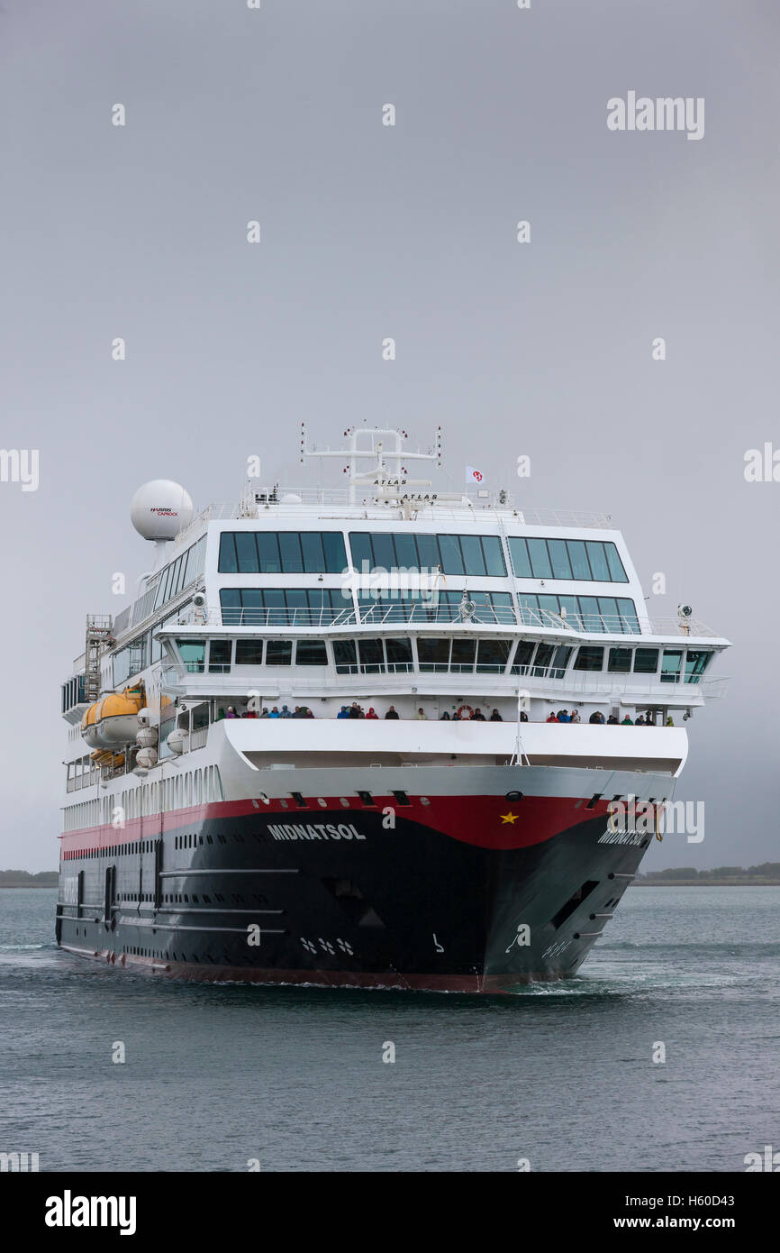 Hurtigruten cruise ship Midnight Sun approaches the dock at at